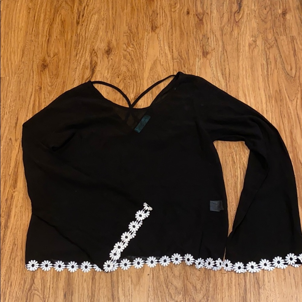 Black bell bottom sleeve top with floral detail